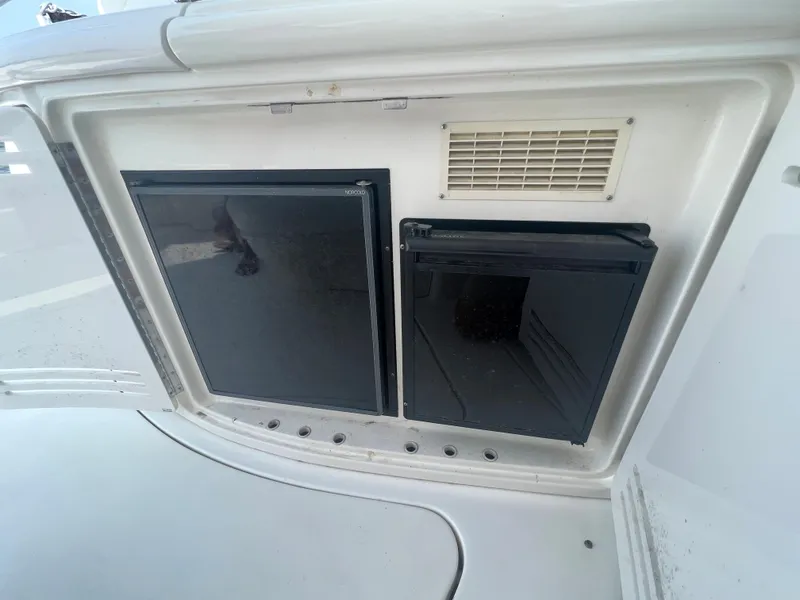 Slide: The Image of Built-in refrigerator and storage compartment on a 2000 Sea Ray 540 Sundancer yacht. - 6