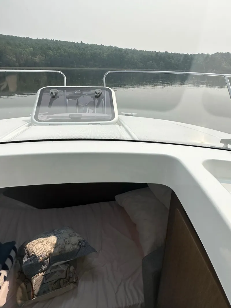 Slide: The Image of 2020 Beneteau Antares 8 OB cabin interior with lake view. - 14