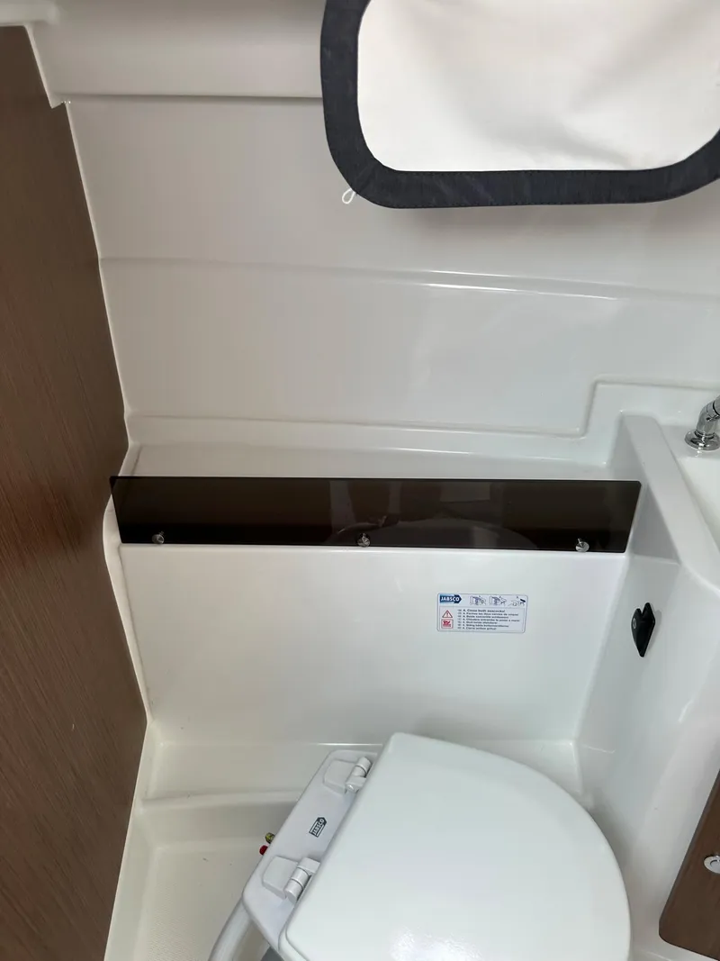 Slide: The Image of 2020 Beneteau Antares 8 OB boat bathroom interior with toilet and sink. - 19