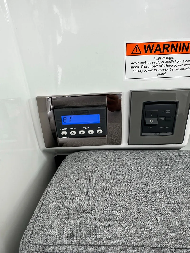 Slide: The Image of Control panel and warning label inside a 2020 Beneteau Antares 8 OB boat. - 24