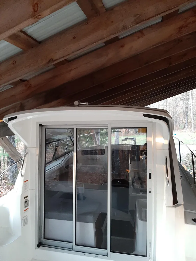 Slide: The Image of 2020 Beneteau Antares 8 OB under a wooden shelter. - 3
