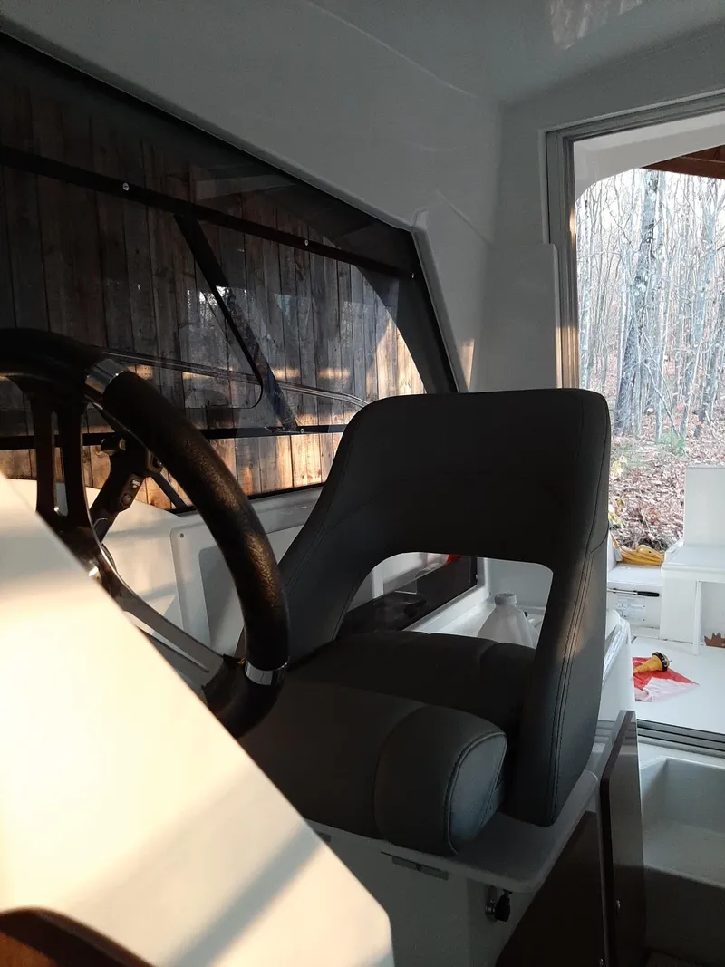 Slide: The Image of Interior helm of 2020 Beneteau Antares 8 OB boat with steering wheel and captain's chair. - 7