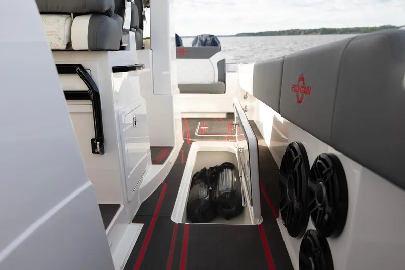 Slide: The Image of 2025 Fountain 43 SCX boat interior with storage compartment and speakers. - 12