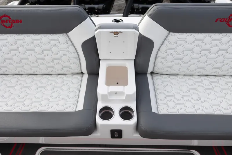 Slide: The Image of 2025 Fountain 43 SCX boat interior seating with cup holders and storage. - 19