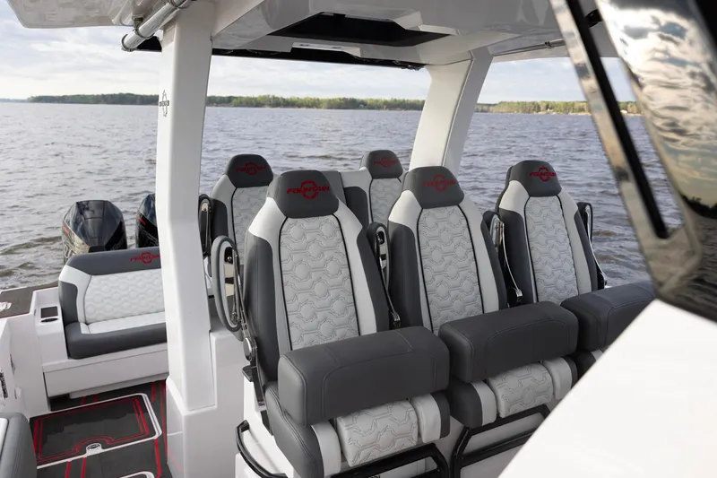 Slide: The Image of 2025 Fountain 43 SCX boat interior with luxurious seating on a lake. - 7