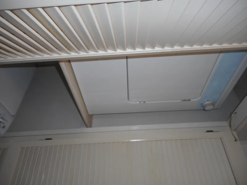Slide: The Image of Interior view of 1995 Stardust Cruisers The Verdict houseboat ceiling and storage compartments. - 10