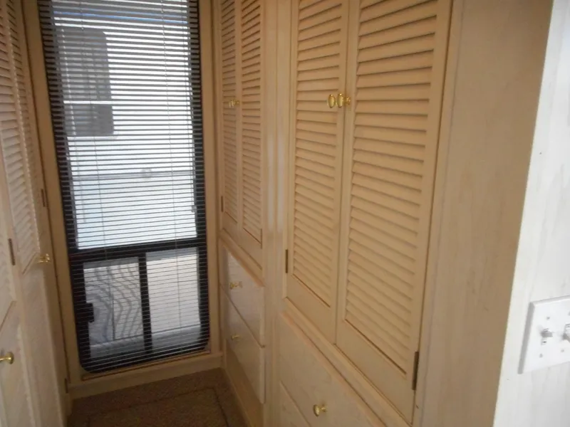 Slide: The Image of 1995 Stardust Cruisers The Verdict interior with wooden cabinets and window blinds - 15