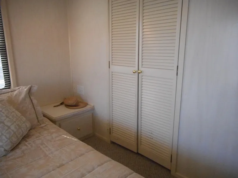 Slide: The Image of Bedroom interior of 1995 Stardust Cruisers The Verdict with closet and nightstand. - 16