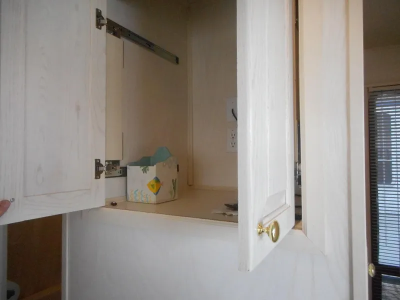 Slide: The Image of Open cabinet in 1995 Stardust Cruisers The Verdict houseboat interior. - 17