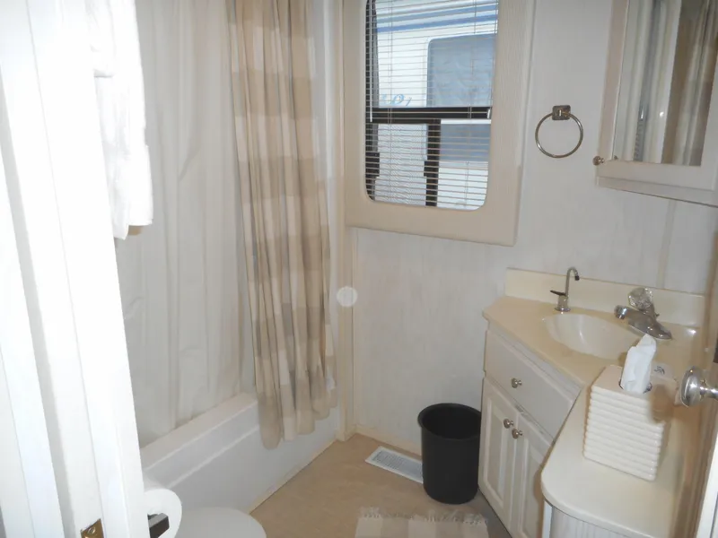 Slide: The Image of 1995 Stardust Cruisers The Verdict bathroom with shower, sink, and window. - 18