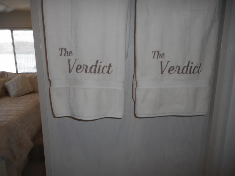 Slide: The Image of Two white towels embroidered with The Verdict hanging in a 1995 Stardust Cruisers houseboat. - 20