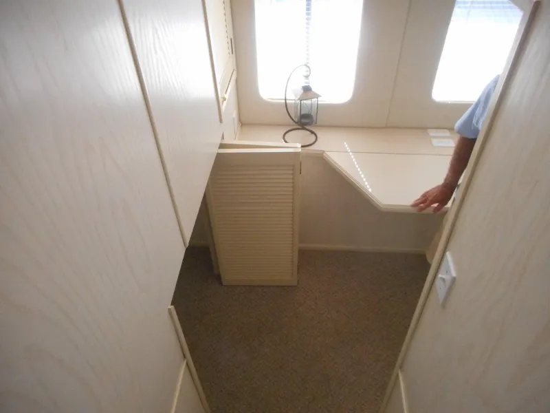 Slide: The Image of Interior cabin of 1995 Stardust Cruisers The Verdict houseboat with desk and windows. - 21