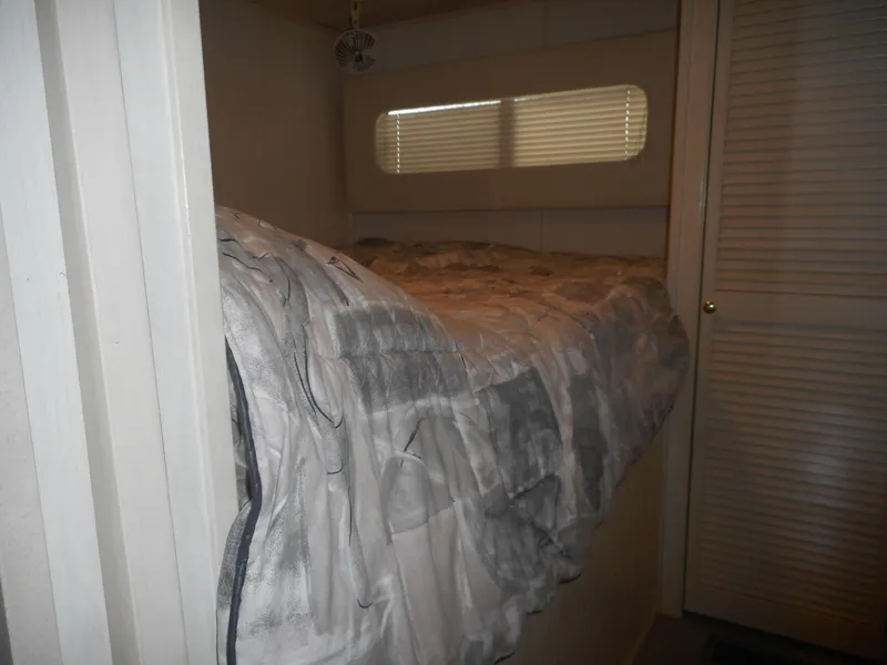 Slide: The Image of Small bedroom with bed in 1995 Stardust Cruisers The Verdict houseboat. - 26
