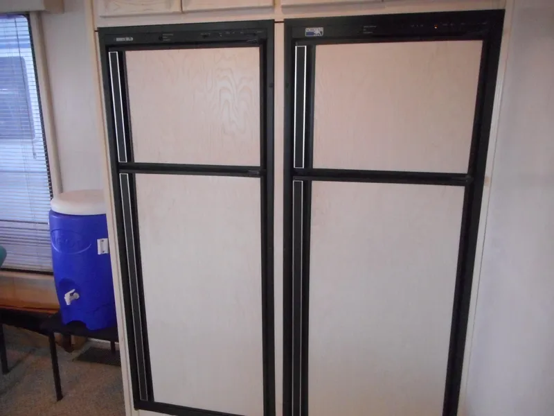 Slide: The Image of 1995 Stardust Cruisers The Verdict interior with dual refrigerators. - 27