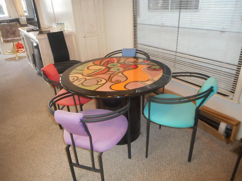 Slide: The Image of Colorful dining area inside 1995 Stardust Cruisers The Verdict houseboat. - 30