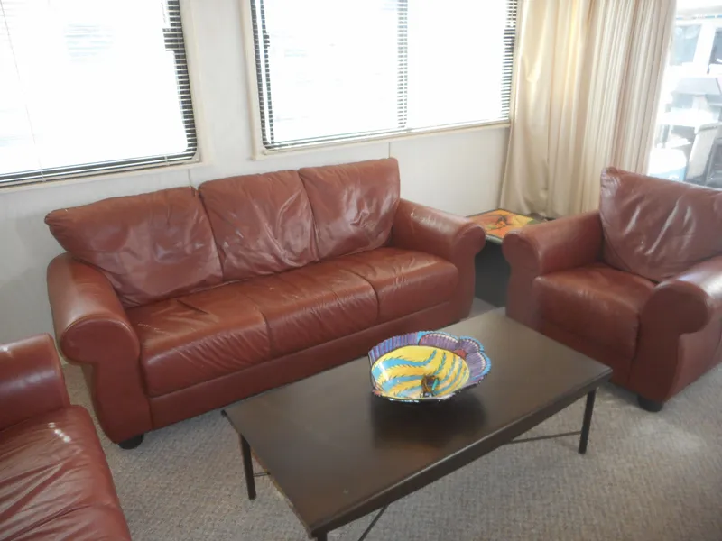 Slide: The Image of 1995 Stardust Cruisers The Verdict interior with red leather sofas and coffee table. - 34