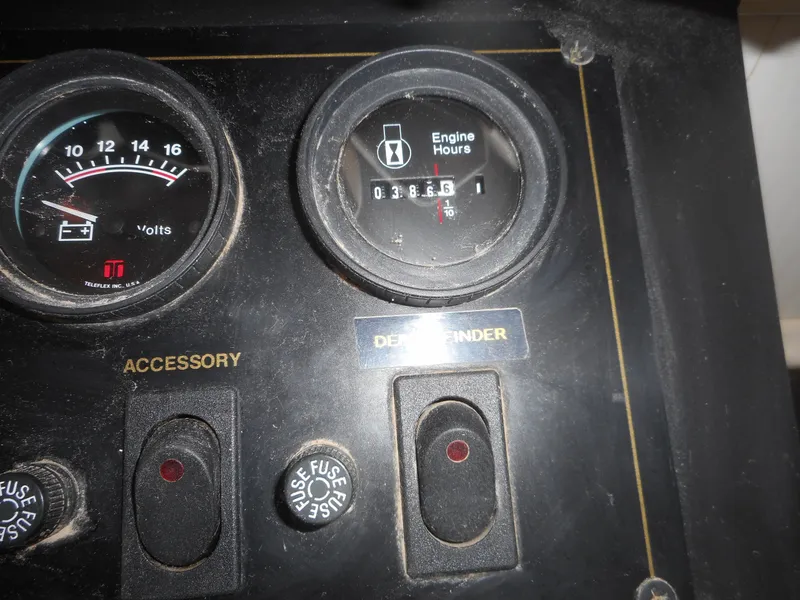 Slide: The Image of 1995 Stardust Cruisers The Verdict control panel with voltmeter and engine hours gauge. - 38