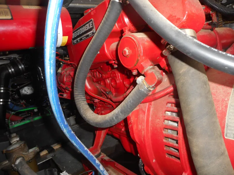 Slide: The Image of Close-up of the engine in a 1995 Stardust Cruisers The Verdict houseboat. - 4