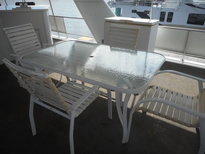 Slide: The Image of Outdoor seating area on a 1995 Stardust Cruisers The Verdict houseboat. - 42