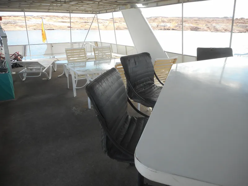 Slide: The Image of Upper deck of 1995 Stardust Cruisers The Verdict houseboat with seating and lake view. - 45