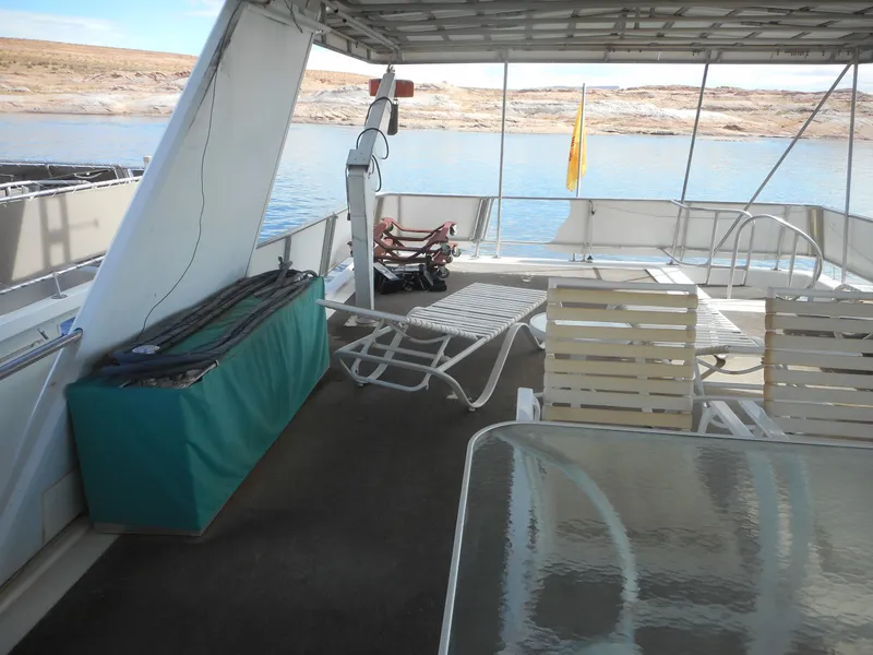 Slide: The Image of Upper deck of 1995 Stardust Cruisers The Verdict houseboat with lounge chairs and lake view. - 48