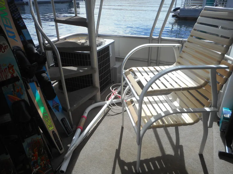 Slide: The Image of Deck of 1995 Stardust Cruisers The Verdict with chair and water sports equipment. - 8