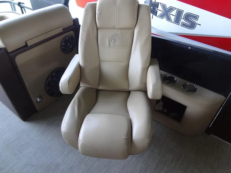 Slide: The Image of 2019 Lowe Retreat 230 RFL boat captain's chair, beige leather, with armrests and cup holders. - 12
