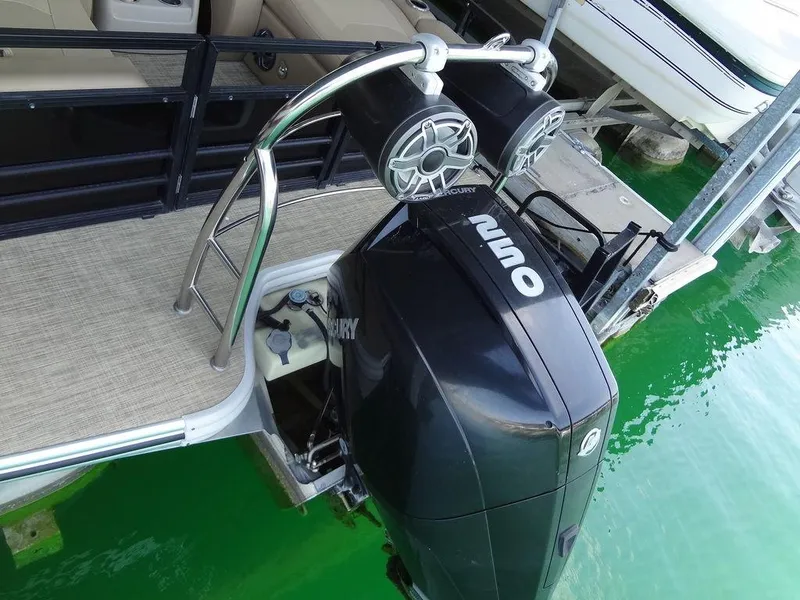 Slide: The Image of 2019 Lowe Retreat 230 RFL boat with Mercury outboard motor and speakers. - 25