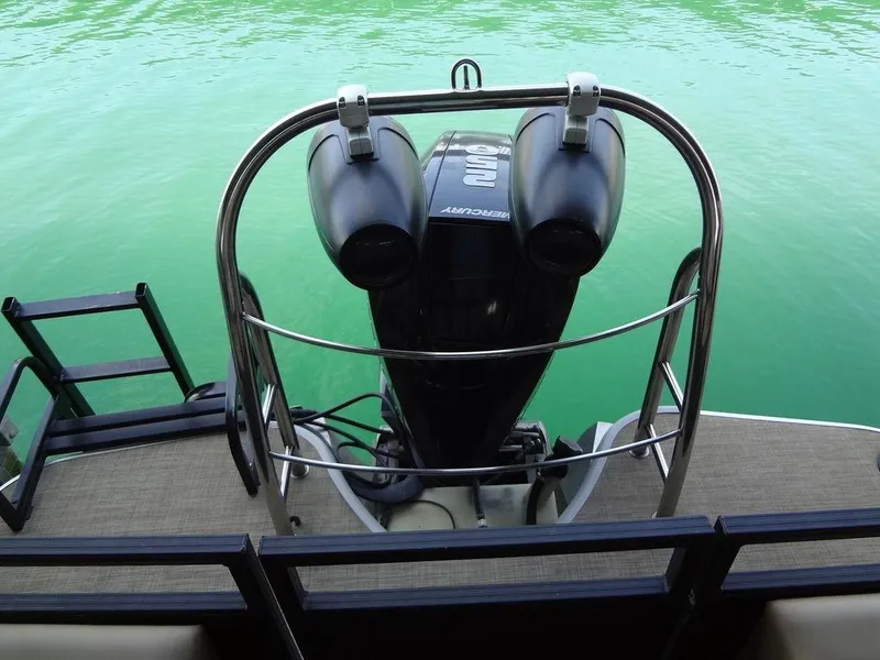Slide: The Image of 2019 Lowe Retreat 230 RFL boat with Mercury outboard motor on water. - 26