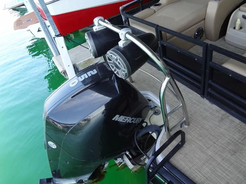 Slide: The Image of 2019 Lowe Retreat 230 RFL pontoon boat with Mercury outboard motor. - 27