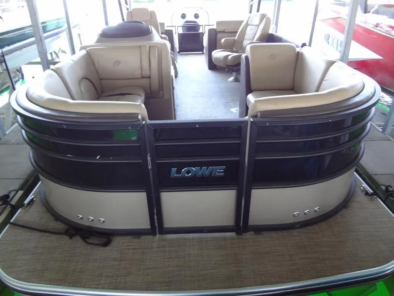 Slide: The Image of 2019 Lowe Retreat 230 RFL pontoon boat with beige seating and black exterior. - 4