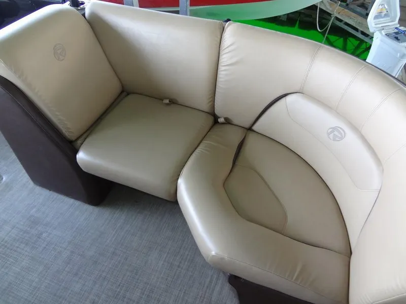 Slide: The Image of 2019 Lowe Retreat 230 RFL beige leather seating area. - 8