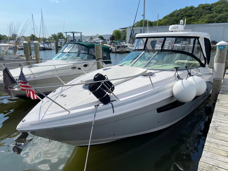 Slide: The Image of 2019 Regal 33 Express boat docked at marina, rear view. - 1