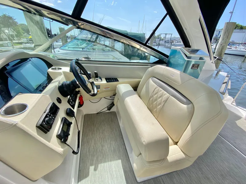 Slide: The Image of 2019 Regal 33 Express yacht interior with kitchenette and sink. - 13