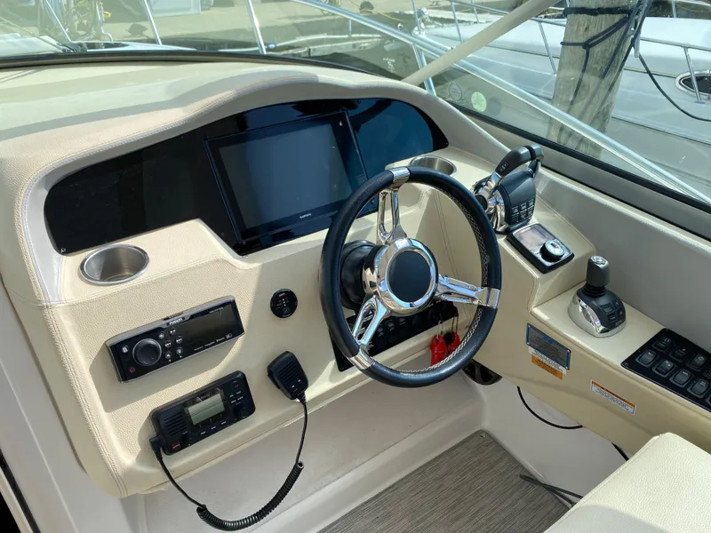 Slide: The Image of 2019 Regal 33 Express boat interior with helm and seating area. - 14