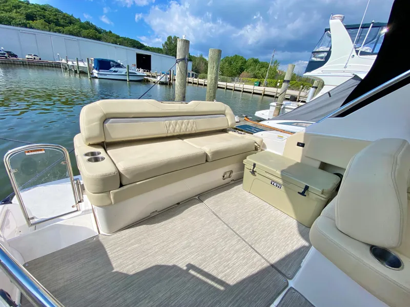 Slide: The Image of 2019 Regal 33 Express boat helm with steering wheel and control panel. - 2