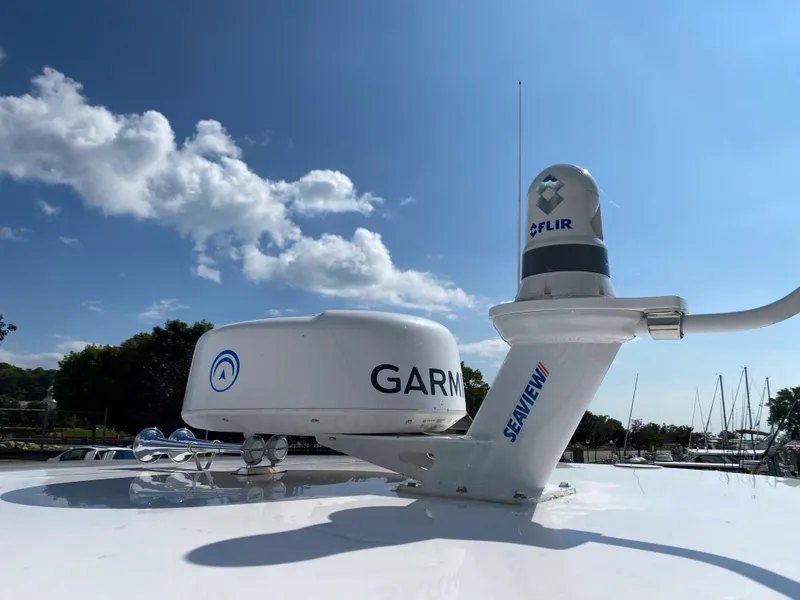 Slide: The Image of Radar and navigation equipment on a 2019 Regal 33 Express boat. - 21