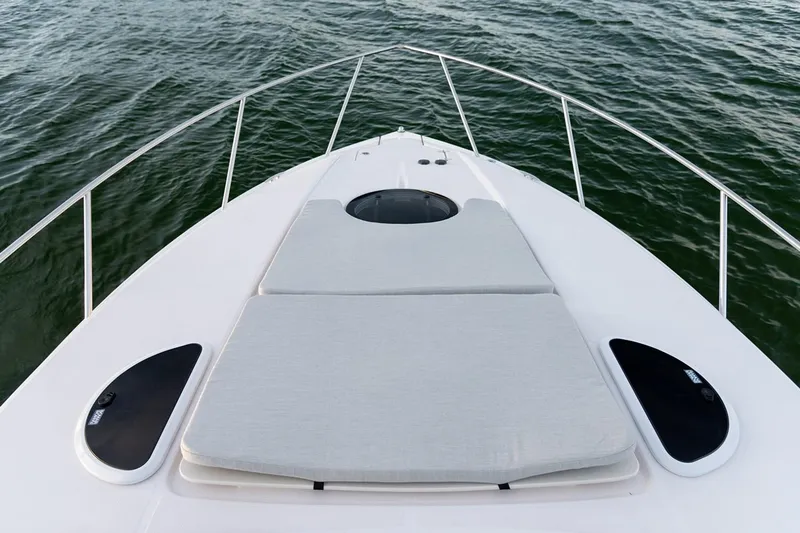 Slide: The Image of 2019 Regal 33 Express boat bathroom with modern fixtures and white decor. - 24