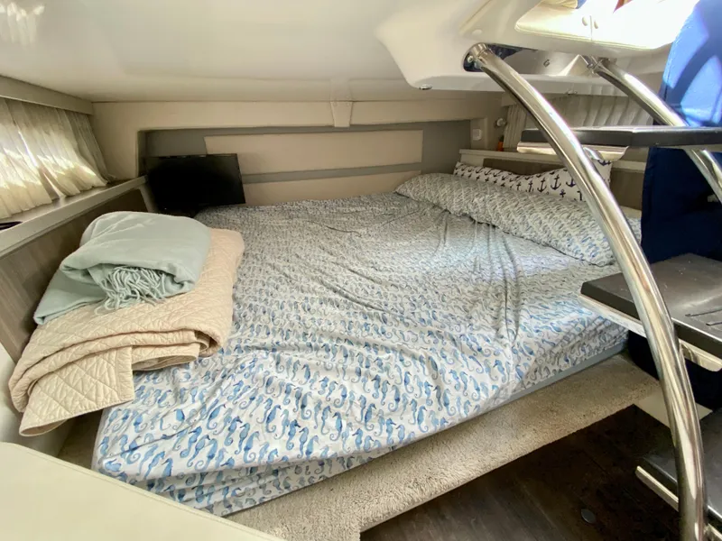 Slide: The Image of 2019 Regal 33 Express boat docked at marina with clear canopy. - 6