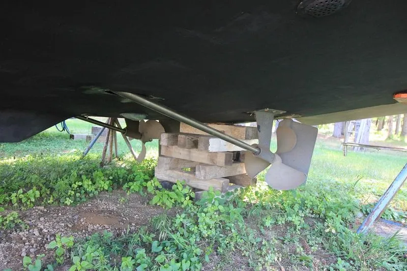 Slide: The Image of 1989 Tollycraft 30 Sport Cruiser propeller and hull on blocks. - 2