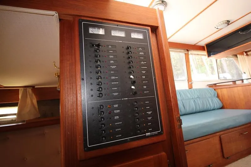 Slide: The Image of Electrical control panel inside a 1989 Tollycraft 30 Sport Cruiser boat. - 24