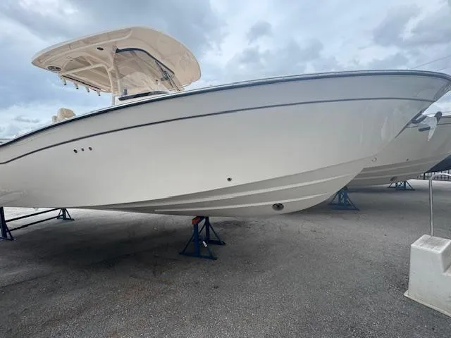 Slide: The Image of 2024 Grady-White Canyon 306 boat on stands, side view. - 14