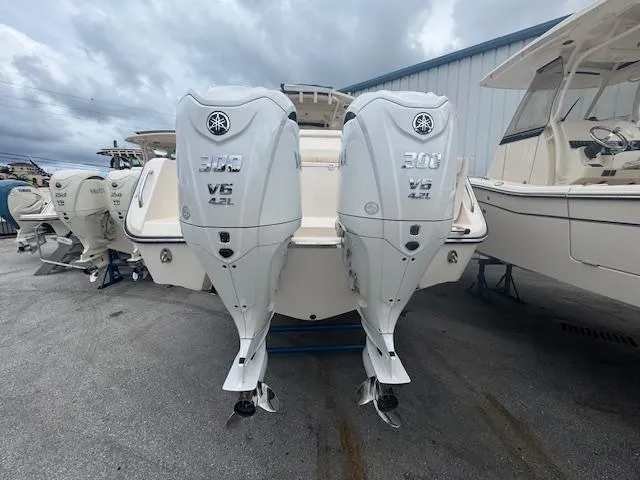 Slide: The Image of 2024 Grady-White Canyon 306 with twin Yamaha 300 V6 outboard engines. - 2
