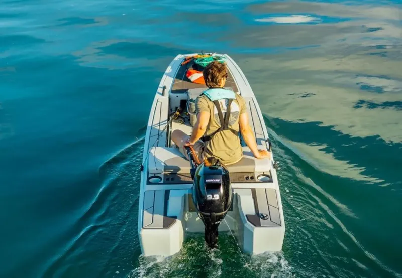 Slide: The Image of 2024 Veer V13 boat on water with person steering. - 5