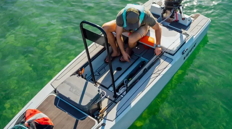 Slide: The Image of Man on Veer V13 boat, 2024 model, preparing equipment on clear water. - 6