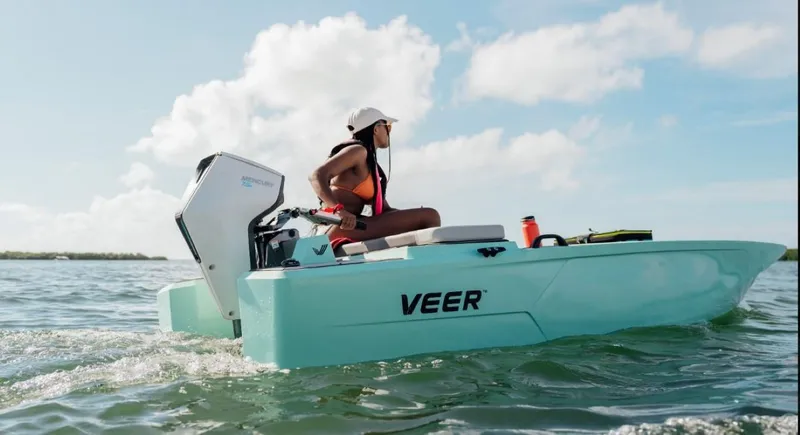 Slide: The Image of Person boating on a 2024 Veer V13 in open water. - 9