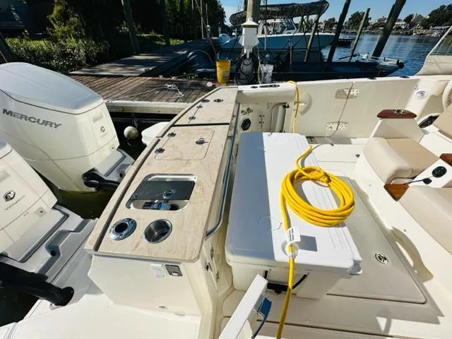 Slide: The Image of 2023 Boston Whaler 360 Outrage boat deck with fishing station and Mercury engines. - 15