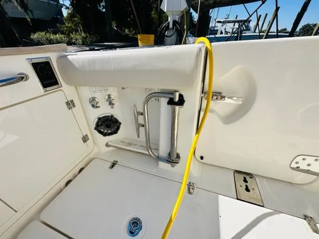 Slide: The Image of Boston Whaler 360 Outrage 2023 boat interior with yellow hose and control panel. - 17
