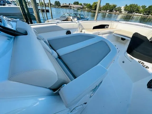 Slide: The Image of 2023 Boston Whaler 360 Outrage boat interior with cushioned seating. - 33
