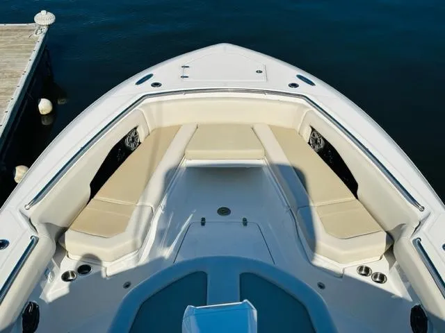 Slide: The Image of 2023 Boston Whaler 360 Outrage boat bow seating area at dock. - 46